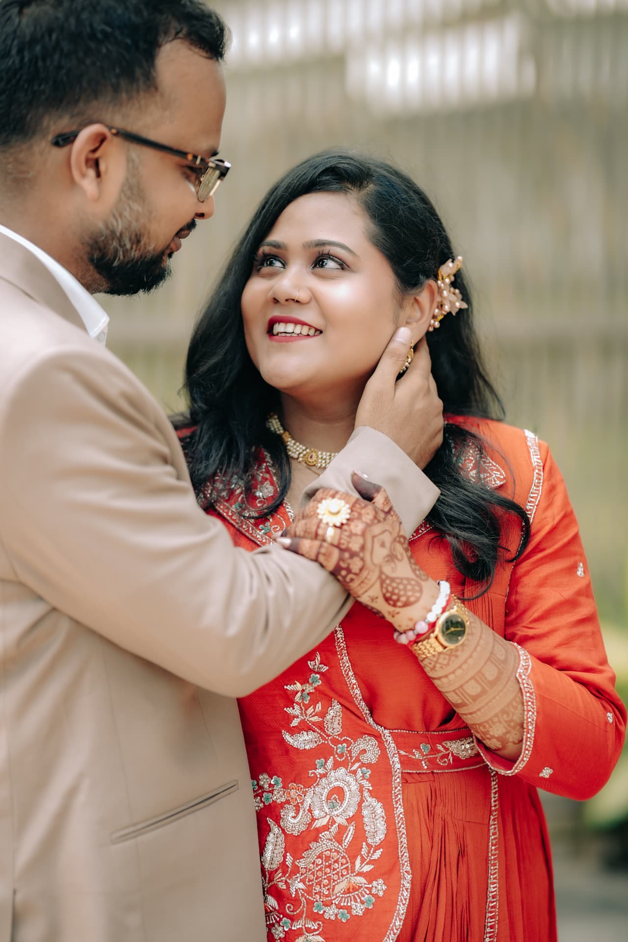 Kunal brushing Survi's hair aside